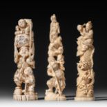 Three Japanese walrus ivory figures, Taisho, H 21,2 - 22,3 - 20,5 cm / 442 - 233 - 275 g