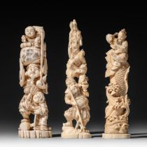 Three Japanese walrus ivory figures, Taisho, H 21,2 - 22,3 - 20,5 cm / 442 - 233 - 275 g