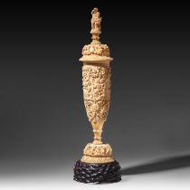 A richly carved baluster-shaped ivory vase with lid, Paris, 19thC, H 68 (without base) 76,5 cm (with