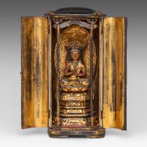 A Japanese lacquered zushi travelling altar with seated Bodhisattva Avalokiteshvara (Kannon), late E