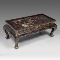 A Chinese lacquered coffee table, with semi-precious stone inlay, 20thC H 42,5 - W 104 - D 53 cm