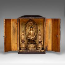 A Japanese lacquer zushi travelling shrine with seated Buddha Gautama and acolytes, late Edo period,