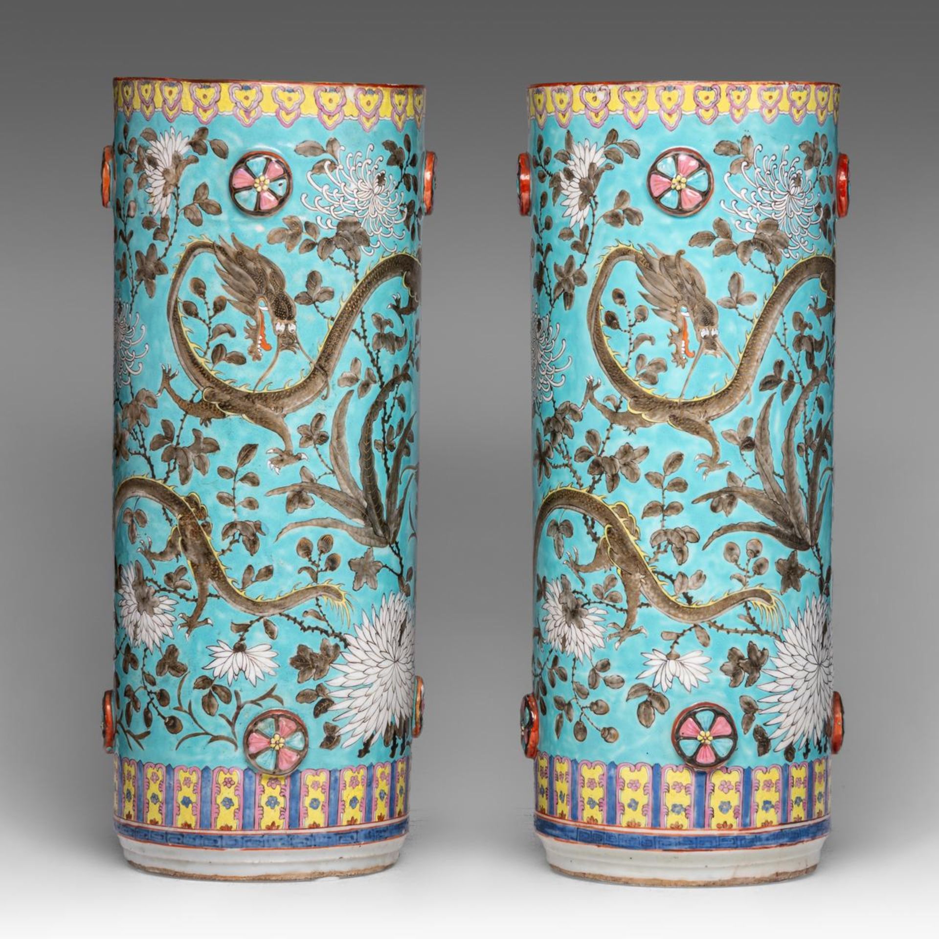 A pair of Chinese Dayazai style turquoise ground 'Dragons amongst Blossoms' umbrella stands, late 19