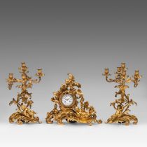 An abundantly decorated Rococo style gilt bronze three-piece mantle clock, signed 'Lepine', Paris, H