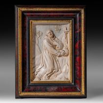 An ivory plaque of St. Francis of Assisi, 18thC, probably French, framed 24,5 x 31 cm (+)