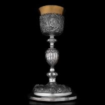 A Renaissance Revival 800/000 silver and gilt silver chalice with its matching paten, H 28 cm - dia