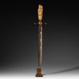A bizarre dagger with a sculpted ivory grip, probably 18th/19thC, total L 40,7 cm - ivory grip L 9,7