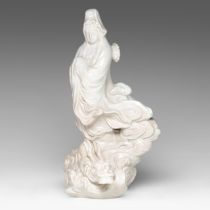 A Japanese white glazed figure of Kannon, late Meiji period, H 36 cm