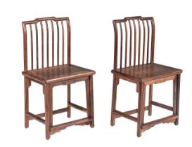 A pair of Chinese hardwood spindle back chairs, Republic period, H 92 - W 48,5 - D 37,5 cm