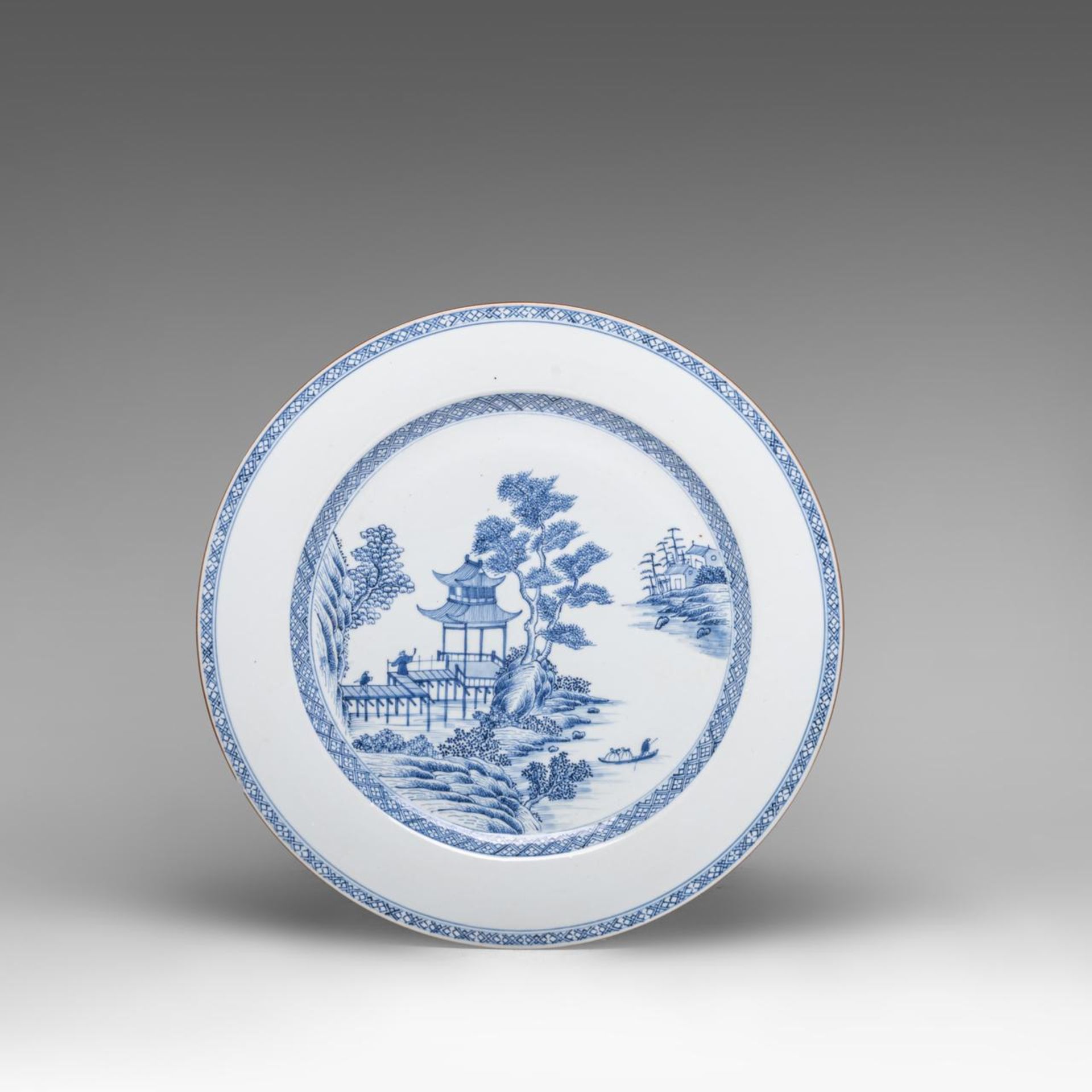 A Chinese blue and white 'Figures and pavilions in a riverscape' large plate, 18thC, dia 39 cm - add - Image 4 of 5