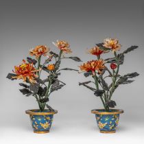 A pair of Chinese cloisonne enamelled planters with a bouquet in semi-precious stone carvings, 20thC