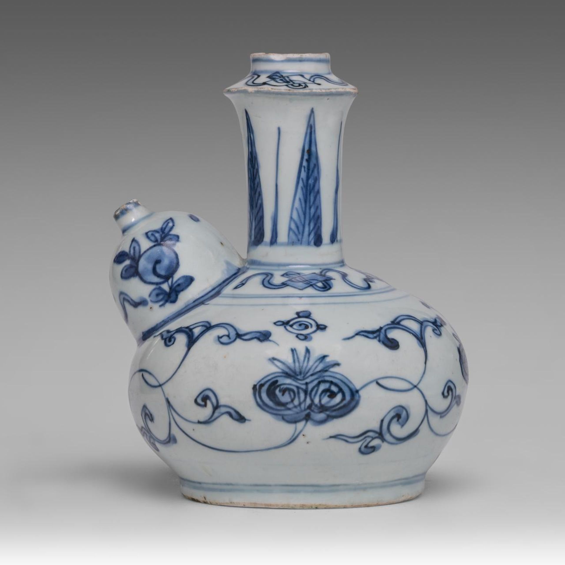A Chinese blue and white 'Pomegranate' kendi jug, Ming dynasty, H 18 cm