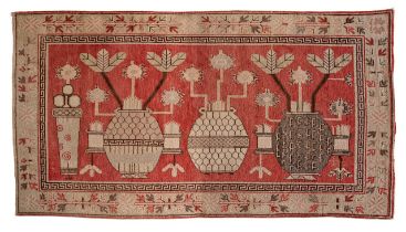 A Persian Samarkand rug, decorated with flower vases, 151 x 281 cm