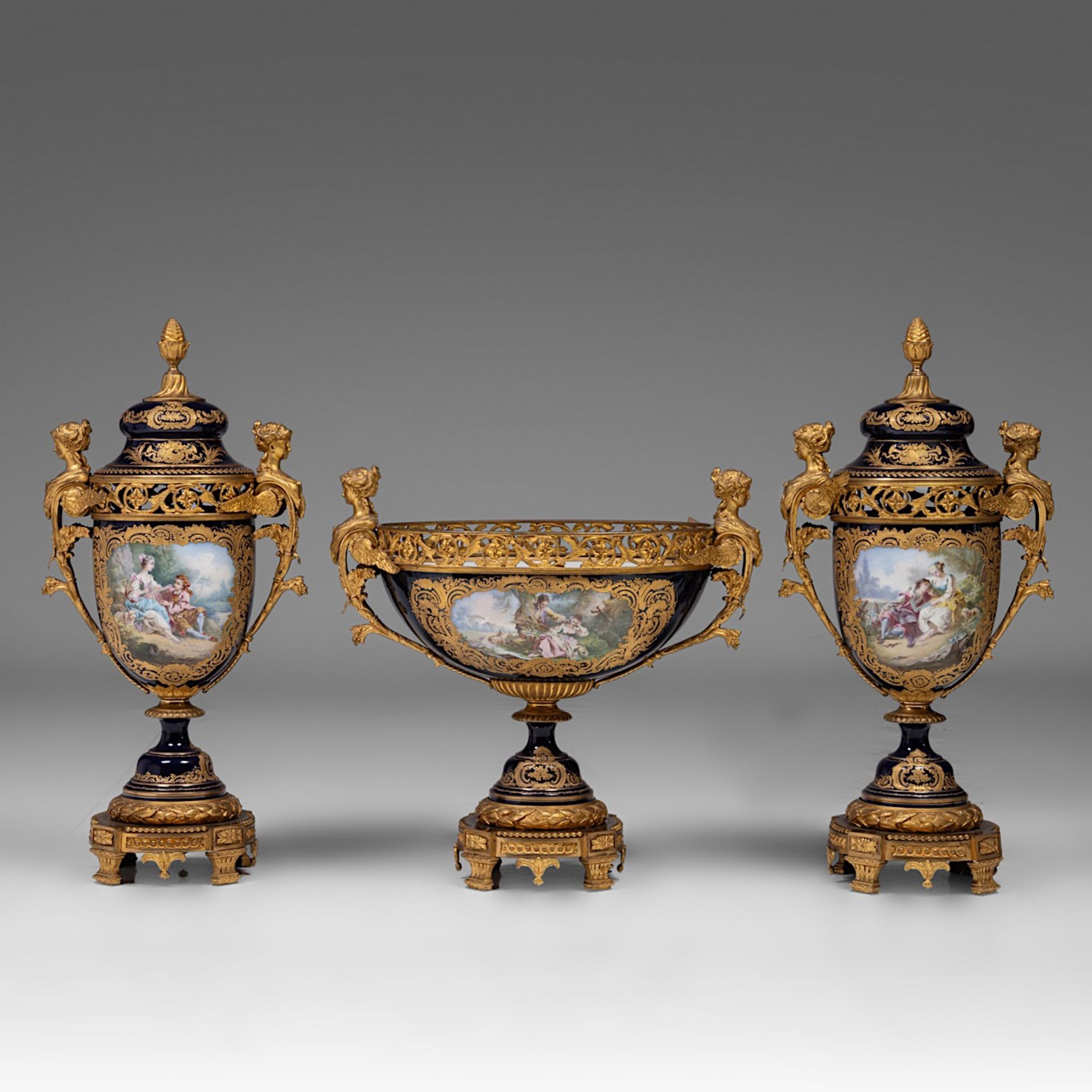 An imposing three-piece Sevres porcelain garniture set, H 53,5 - 72,5 cm