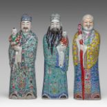 Two Chinese famille rose glazed figures of Fu Xing and one of Shou Xing, all impressed marked at the