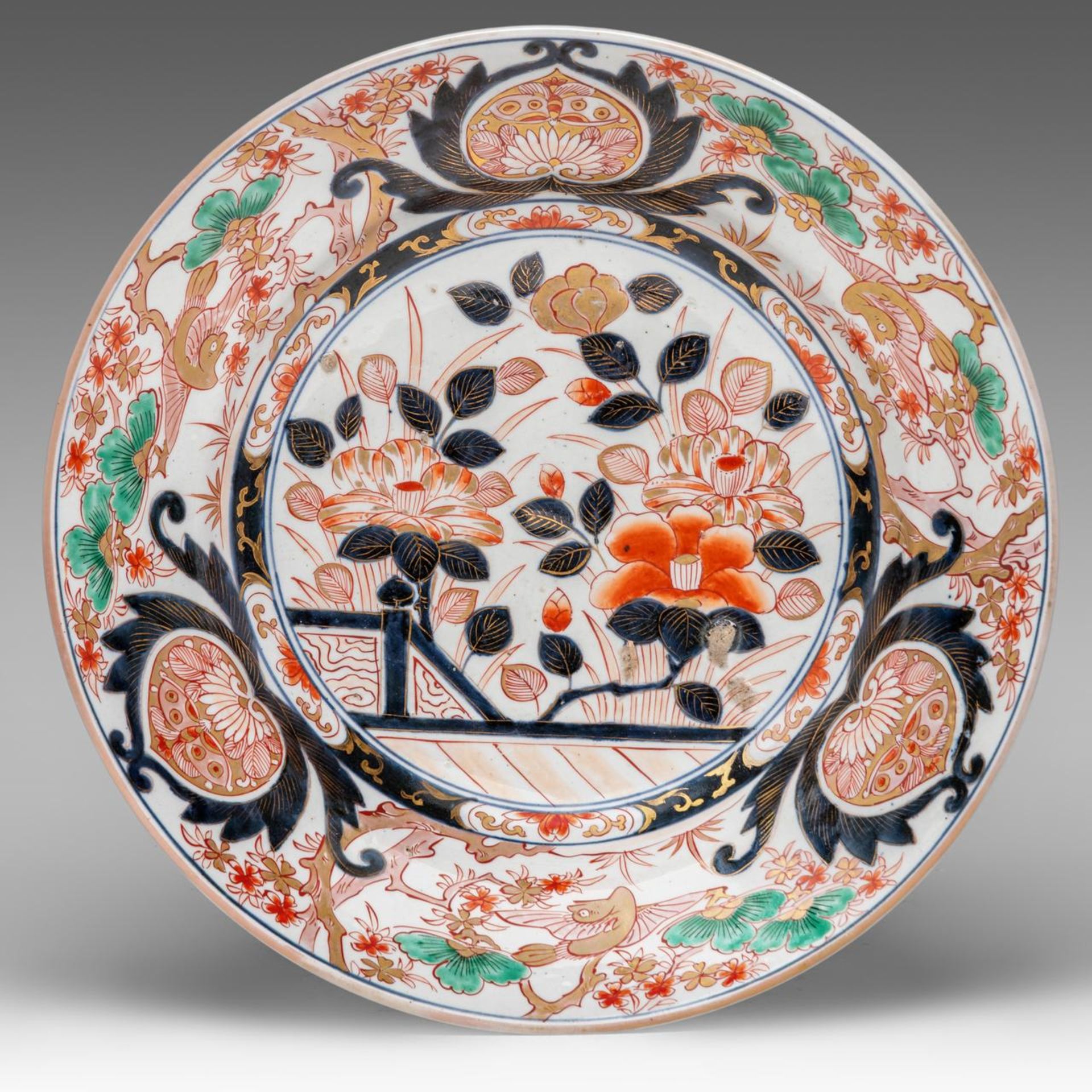 A Japanese Imari 'Peony garden' large plate, Meiji period, dia 39 cm