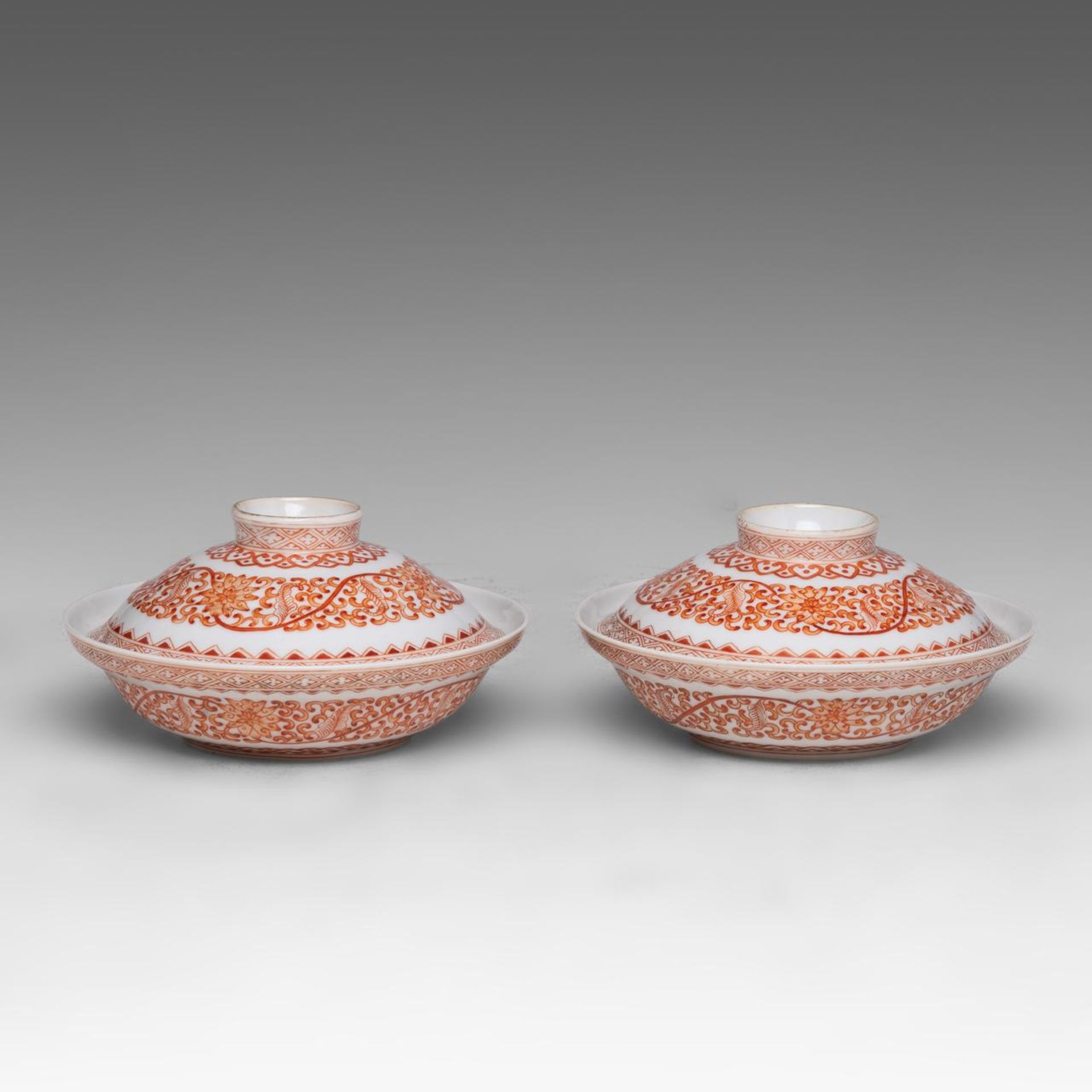 A pair of Chinese iron-red 'Lotus Scroll' lidded serving bowls, marked Guangxu and of the period, di
