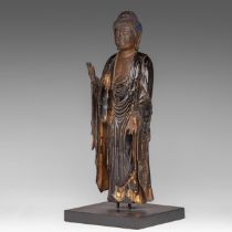 A Japanese polychrome and gilt lacquered figure of standing Buddha, presumably Edo period, H 34,5 cm