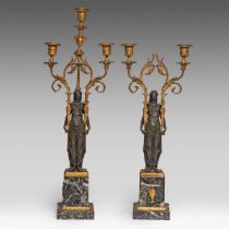 A pair of Empire style patinated and gilt bronze and marble figural candelabras, H 55 - 65 cm