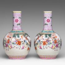 A pair of Chinese famille rose 'Playful boys' bottle vases, 20thC, H 39 cm