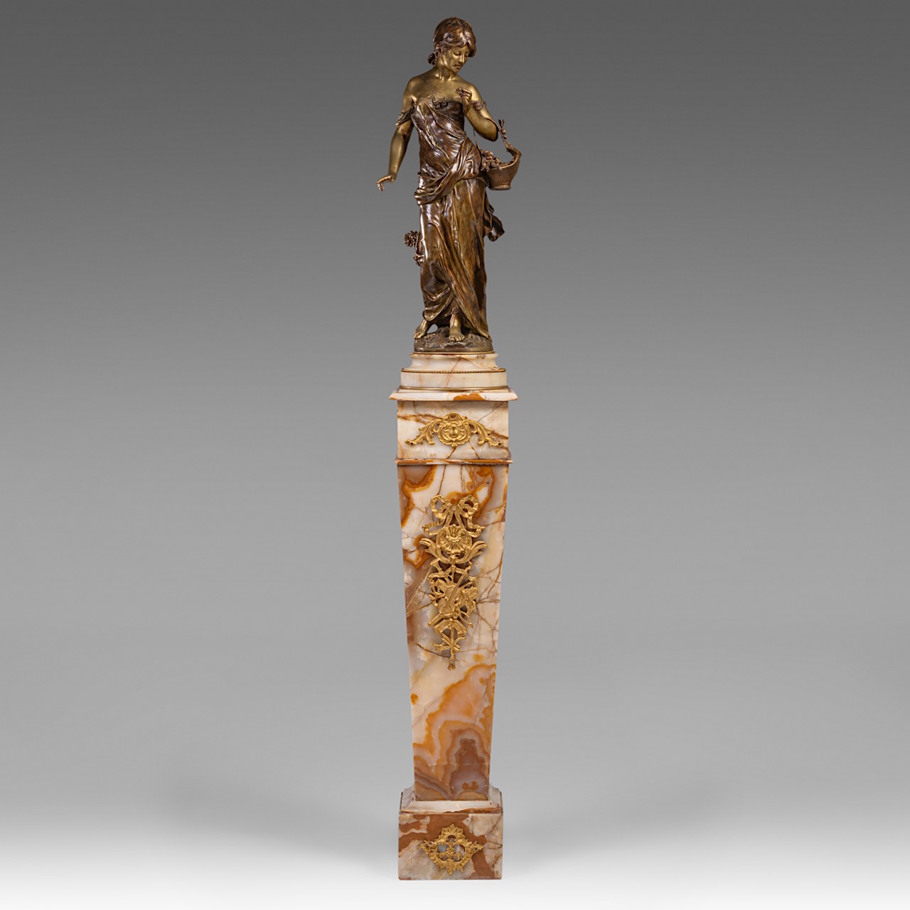 Auguste Moreau (1834-1917), lady with flower basket, patinated bronze on a Neoclassical onyx pedesta