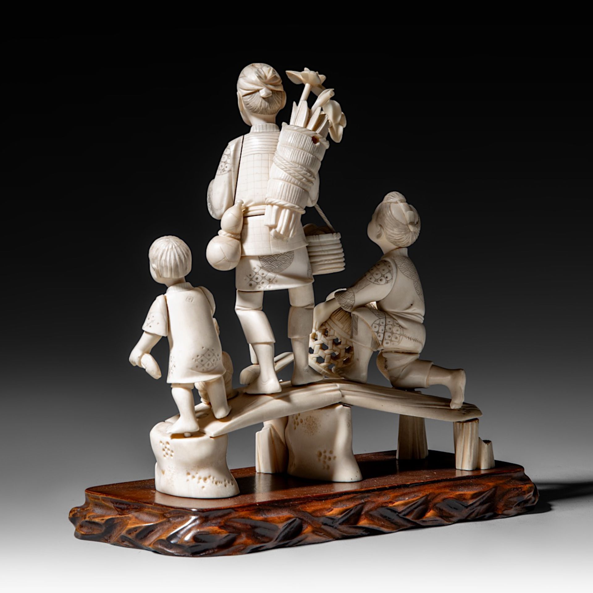 A Japanese hippo and walrus ivory okimono of a family fishing, Showa period (1926-1989), H 20 cm - W - Image 4 of 11
