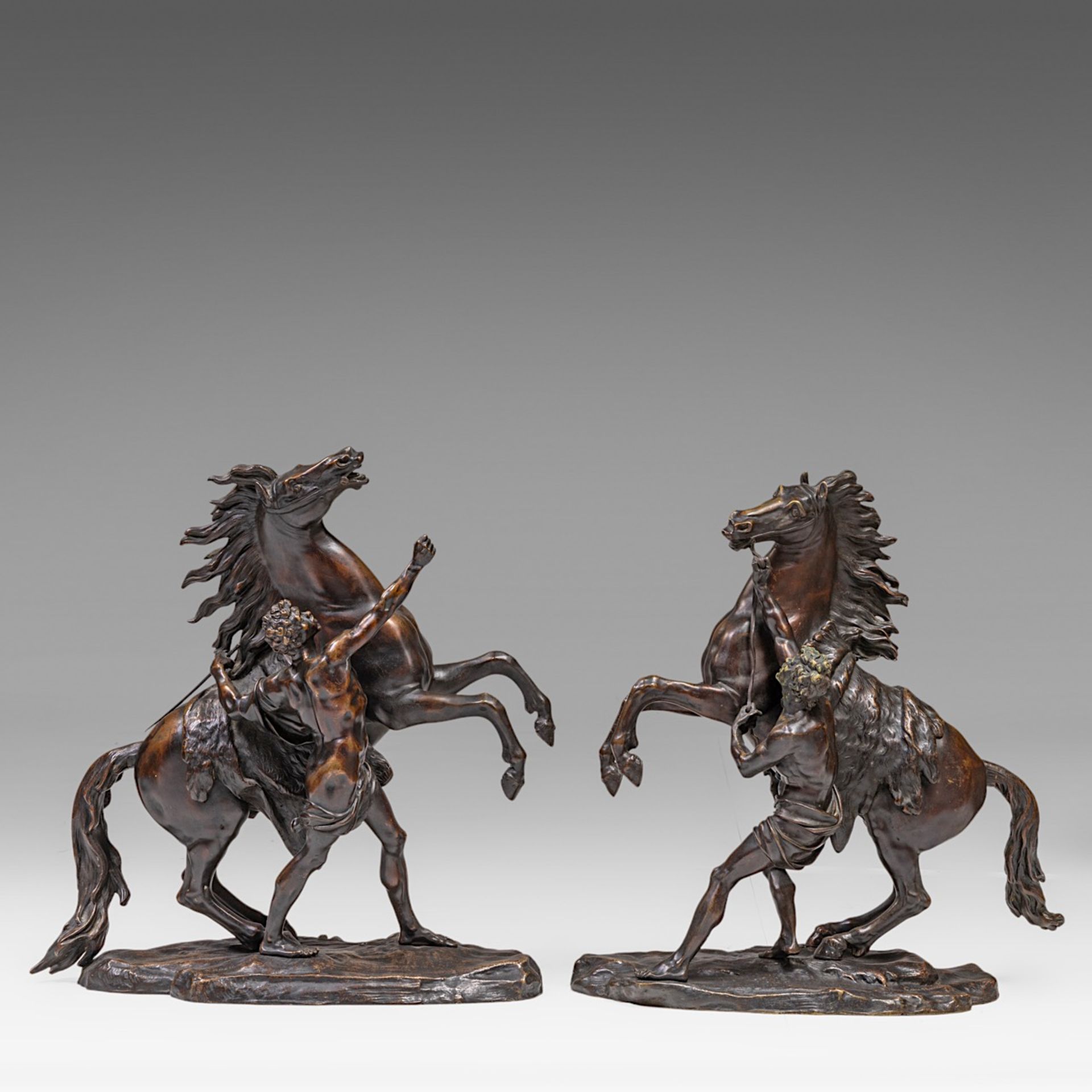 After Guillaume Coustou (1677-1746), the Marly horses, patinated bronze, H 58 cm