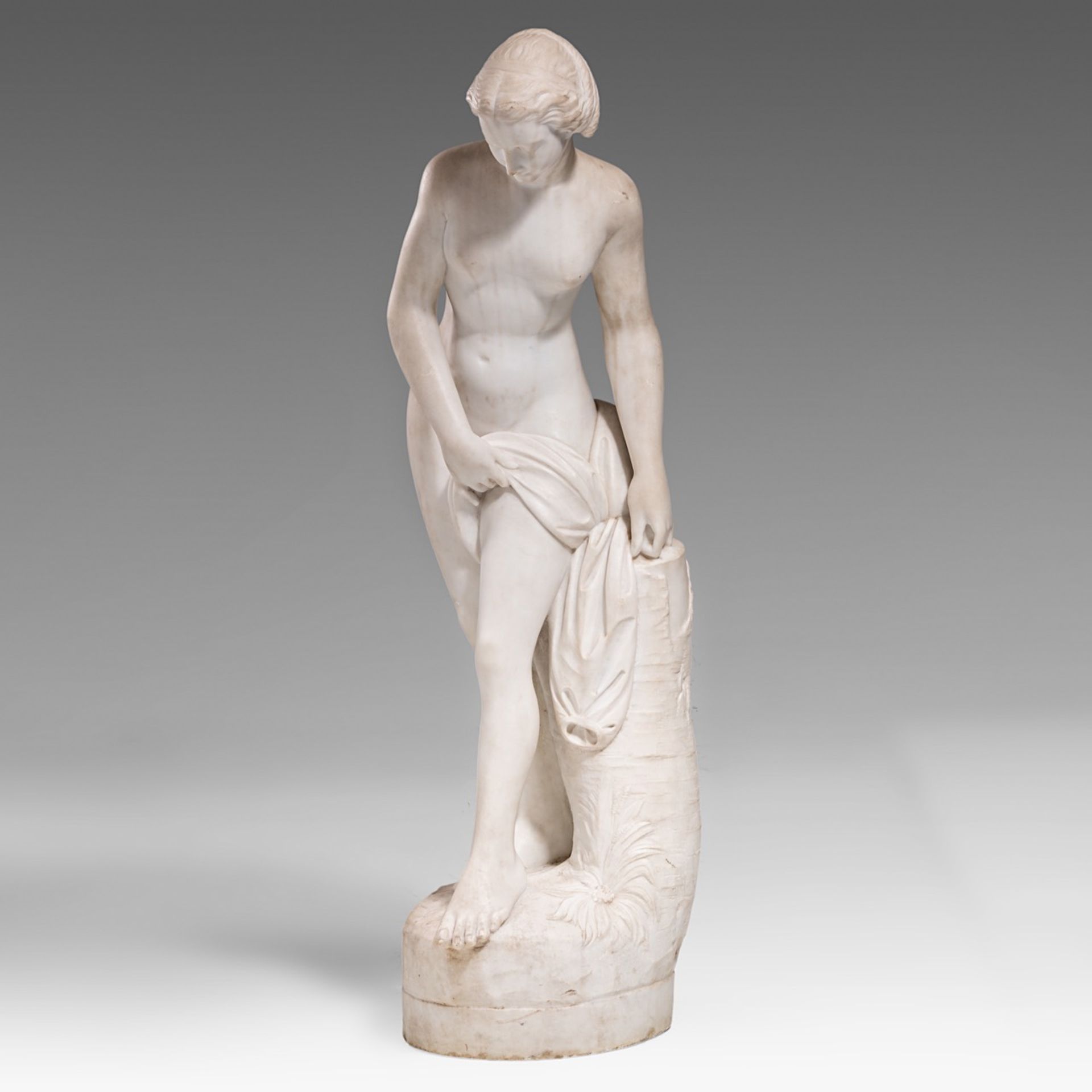 A Carrara marble sculpture of the bathing Venus, ca. 1900, H 98 cm