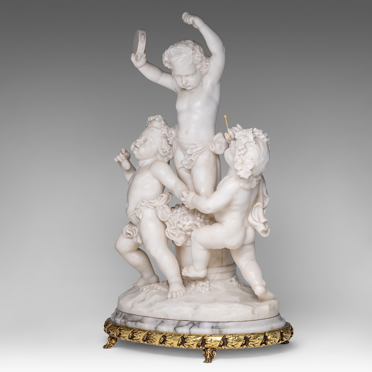 A charming alabaster group of playing putti, on a gilt brass stand, H 68 cm (total) - Image 2 of 9