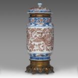 A Chinese copper-red and underglaze blue 'Phoenixes amongst Peonies' albarello lantern vase, with a