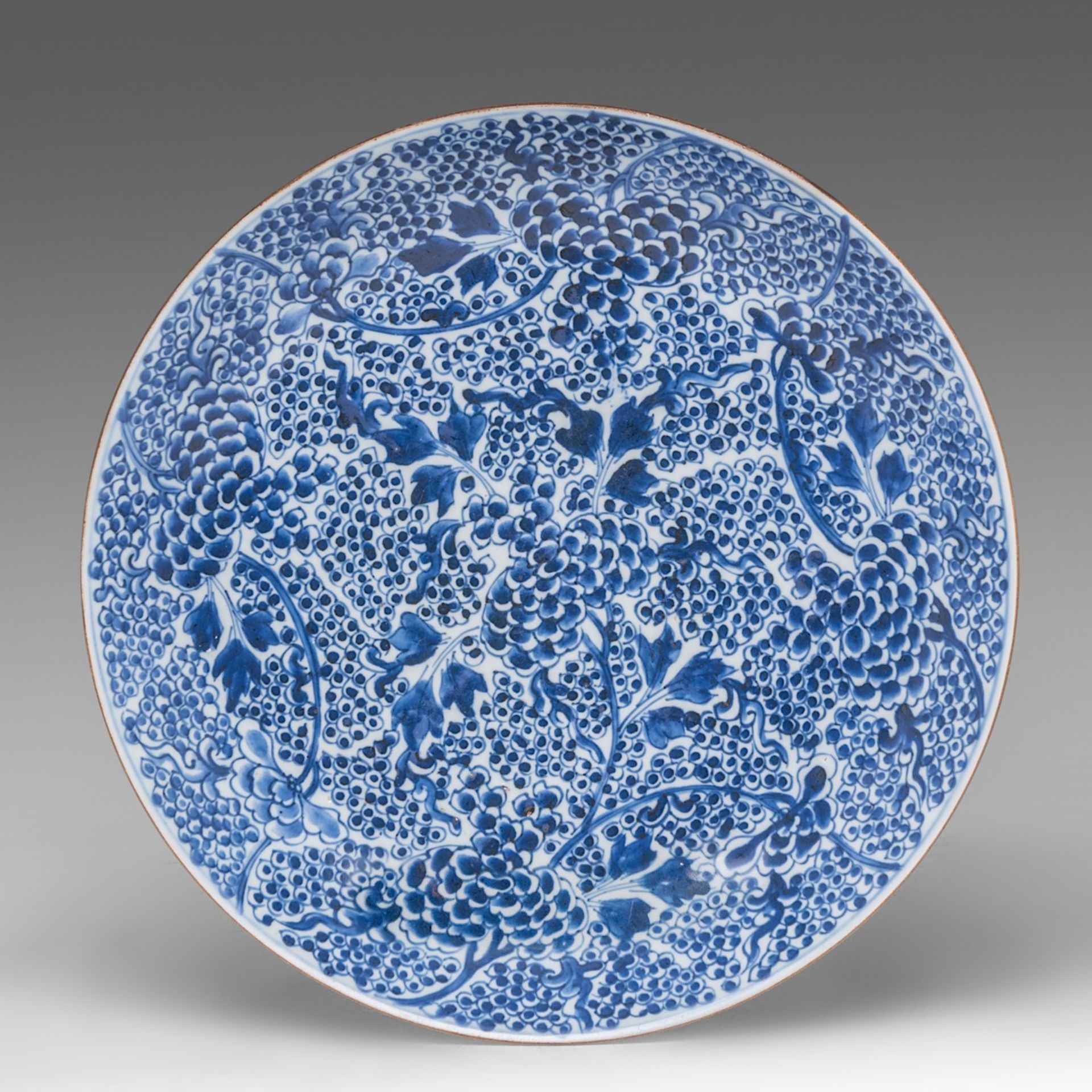 A Chinese blue and white 'Peony Scroll' plate, Kangxi period, dia 35 cm - added a series of four flo - Image 2 of 7