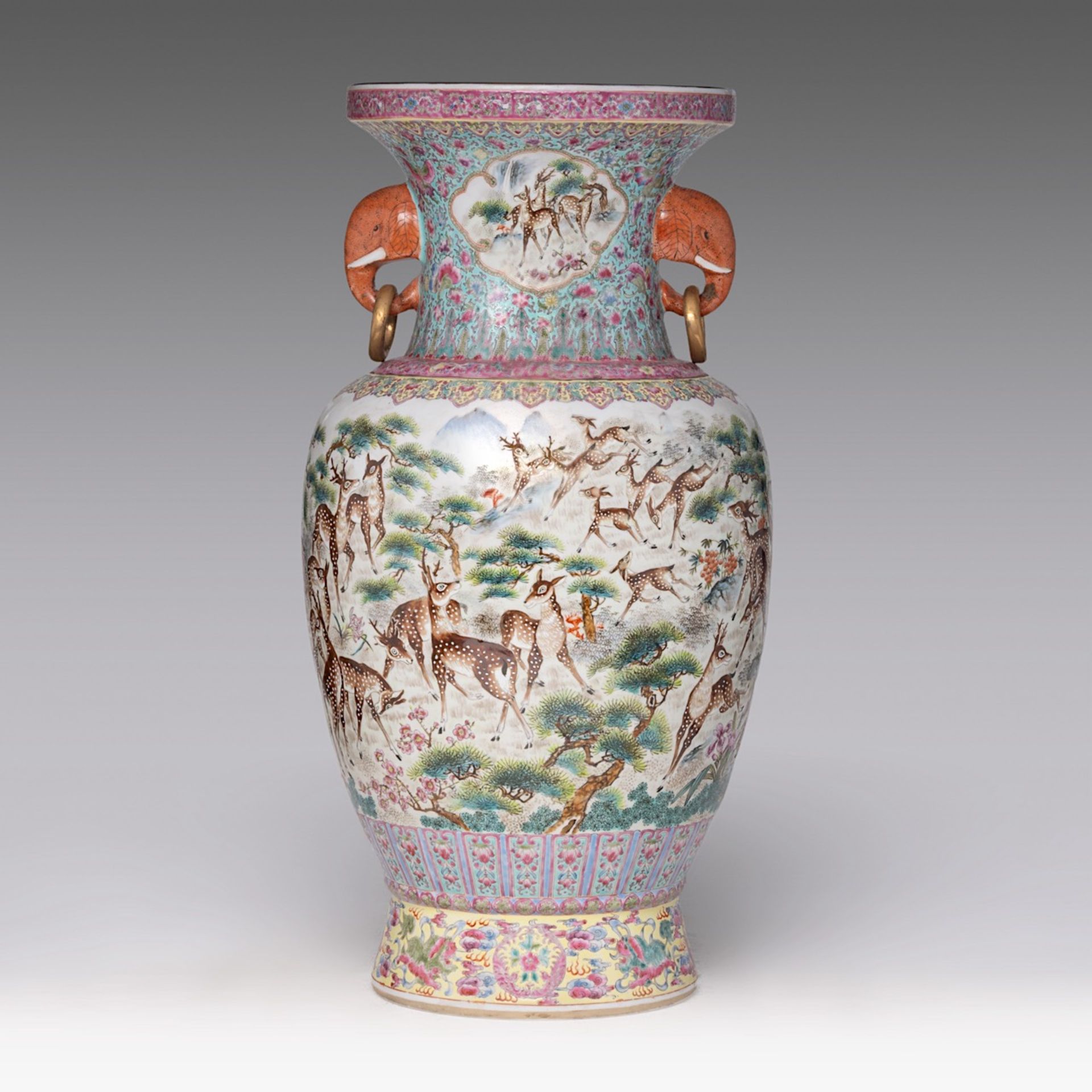 A Chinese famille rose 'One Hundred Deer' vase, paired with elephant-head handles, with a signed tex