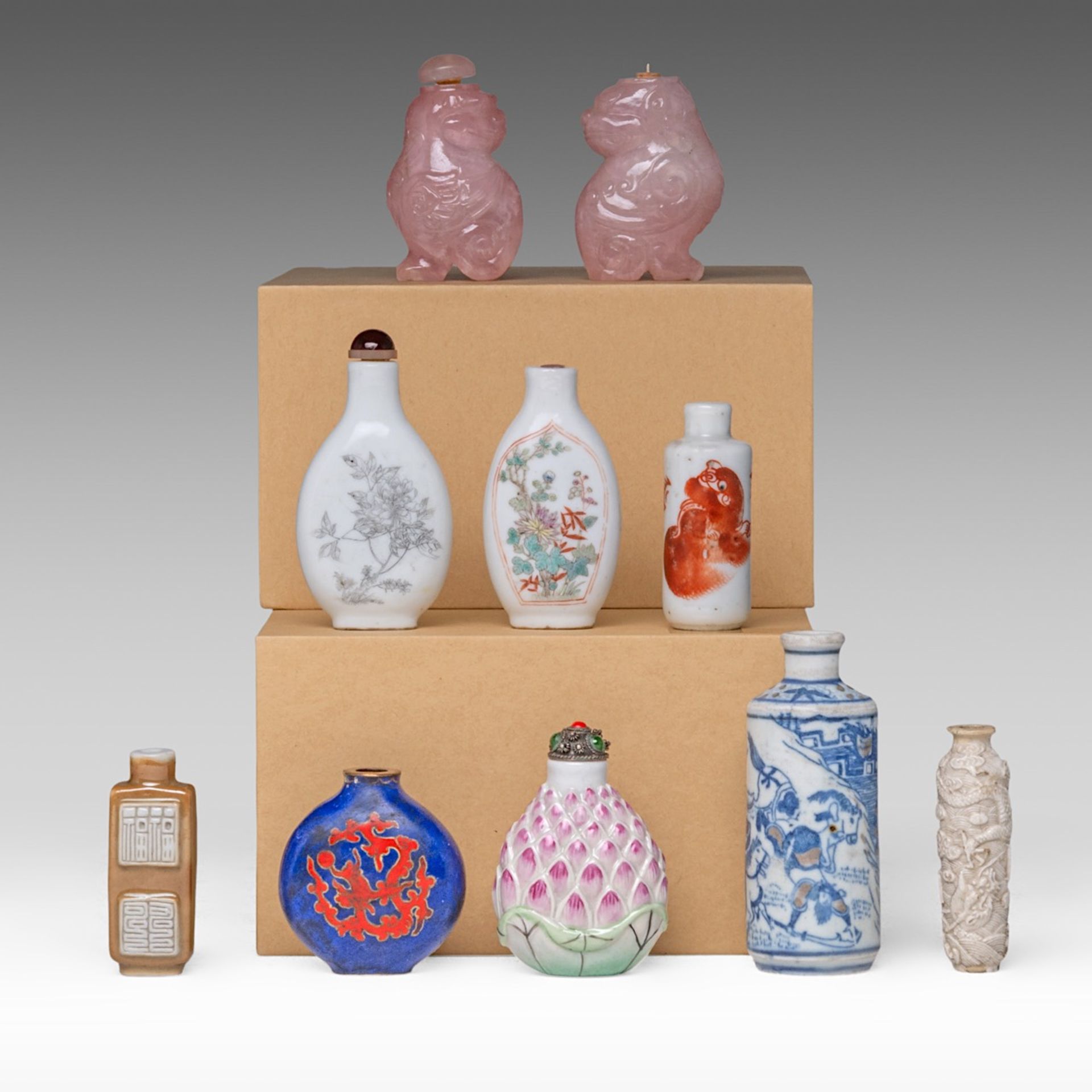 A collection of ten Chinese snuff bottle, including a copper red and underglaze blue 'Battle Scene'