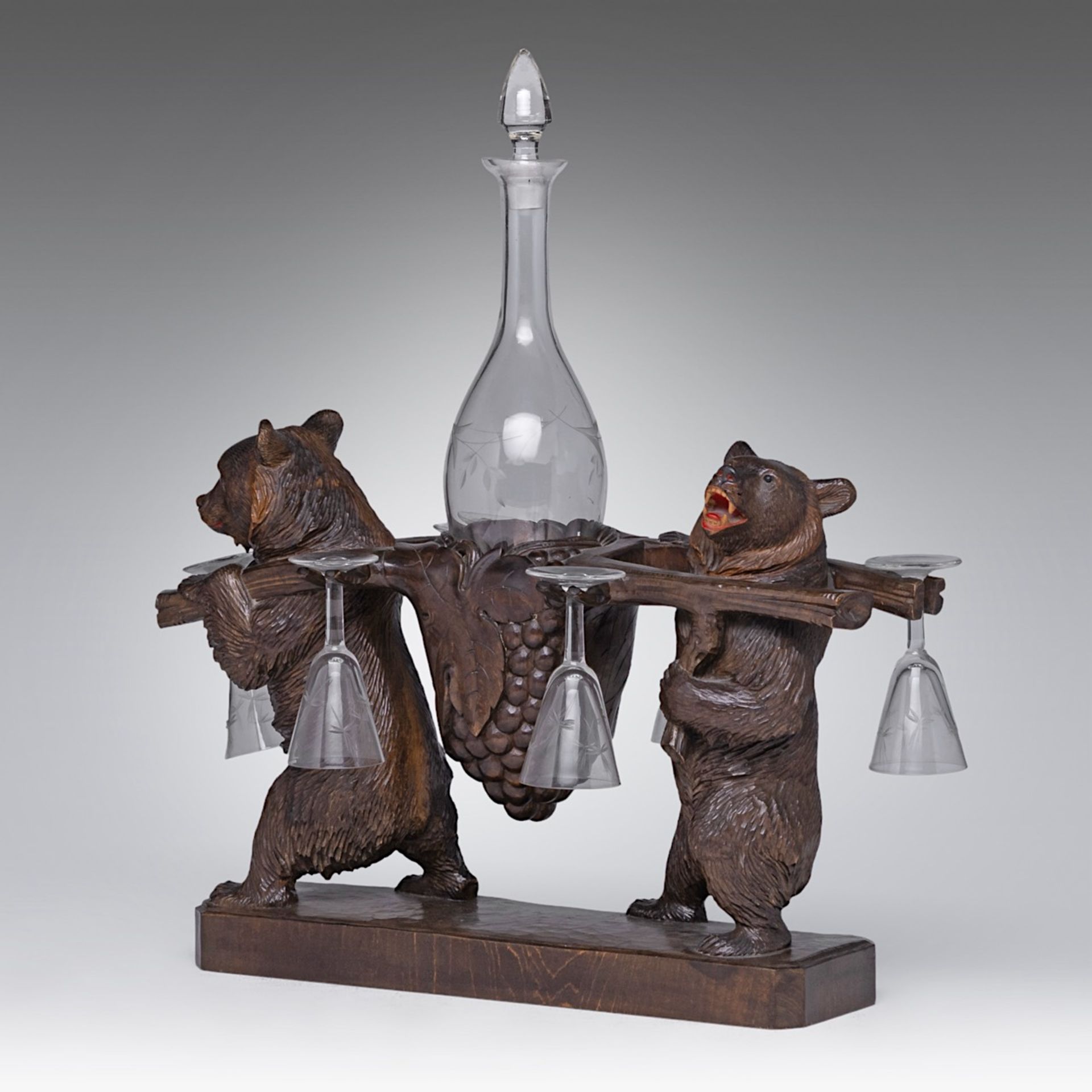 A Black Forest carved wooden liquor stand with two bears carrying the decanter and six glasses, H 4 - Image 10 of 10