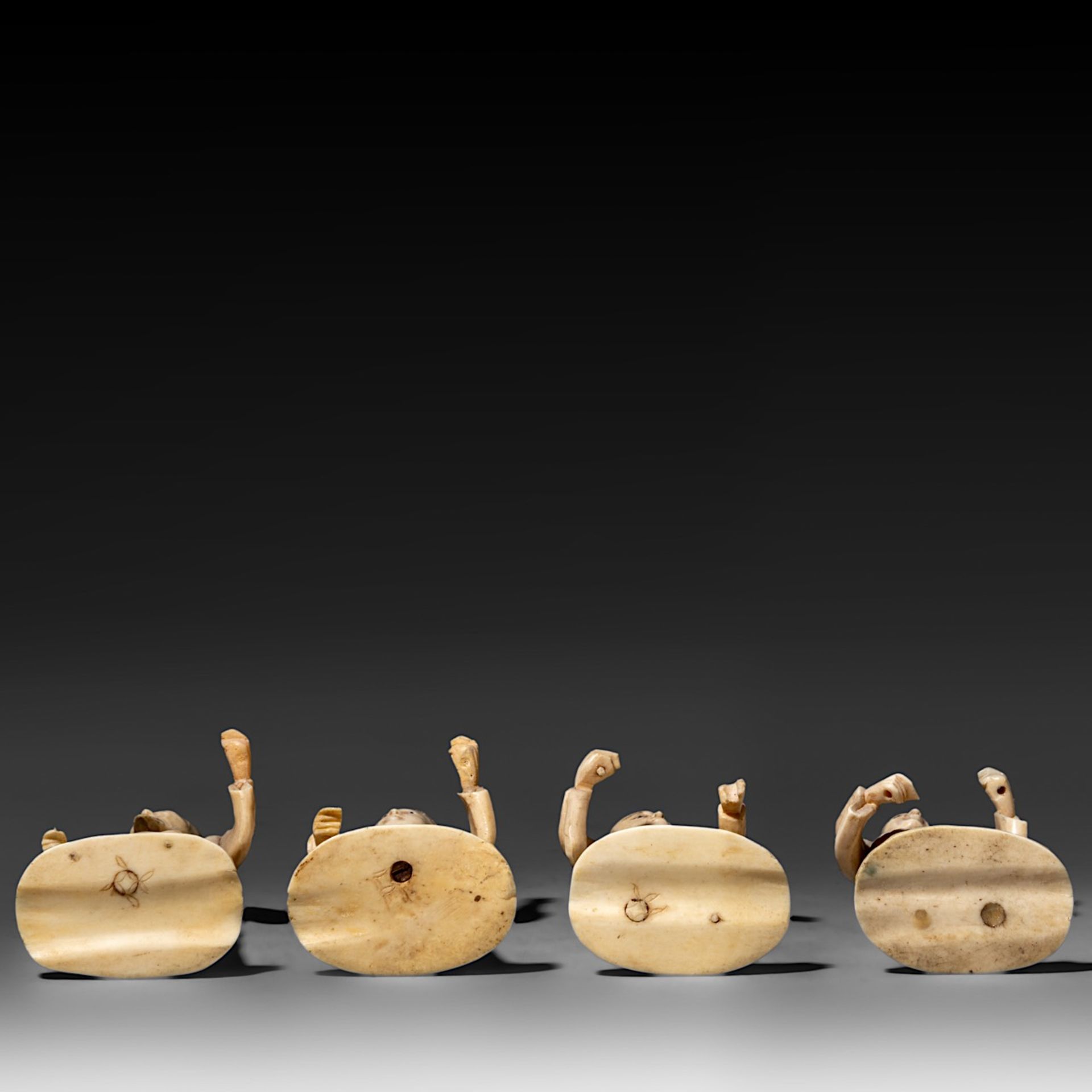 Four Japanese bone okimono, the figures possibly representing different classes in society, on a woo - Bild 7 aus 7