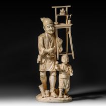 A large Japanese walrus ivory okimono of an artisan with his son, Meiji period (1868-1912), H 46,5 -