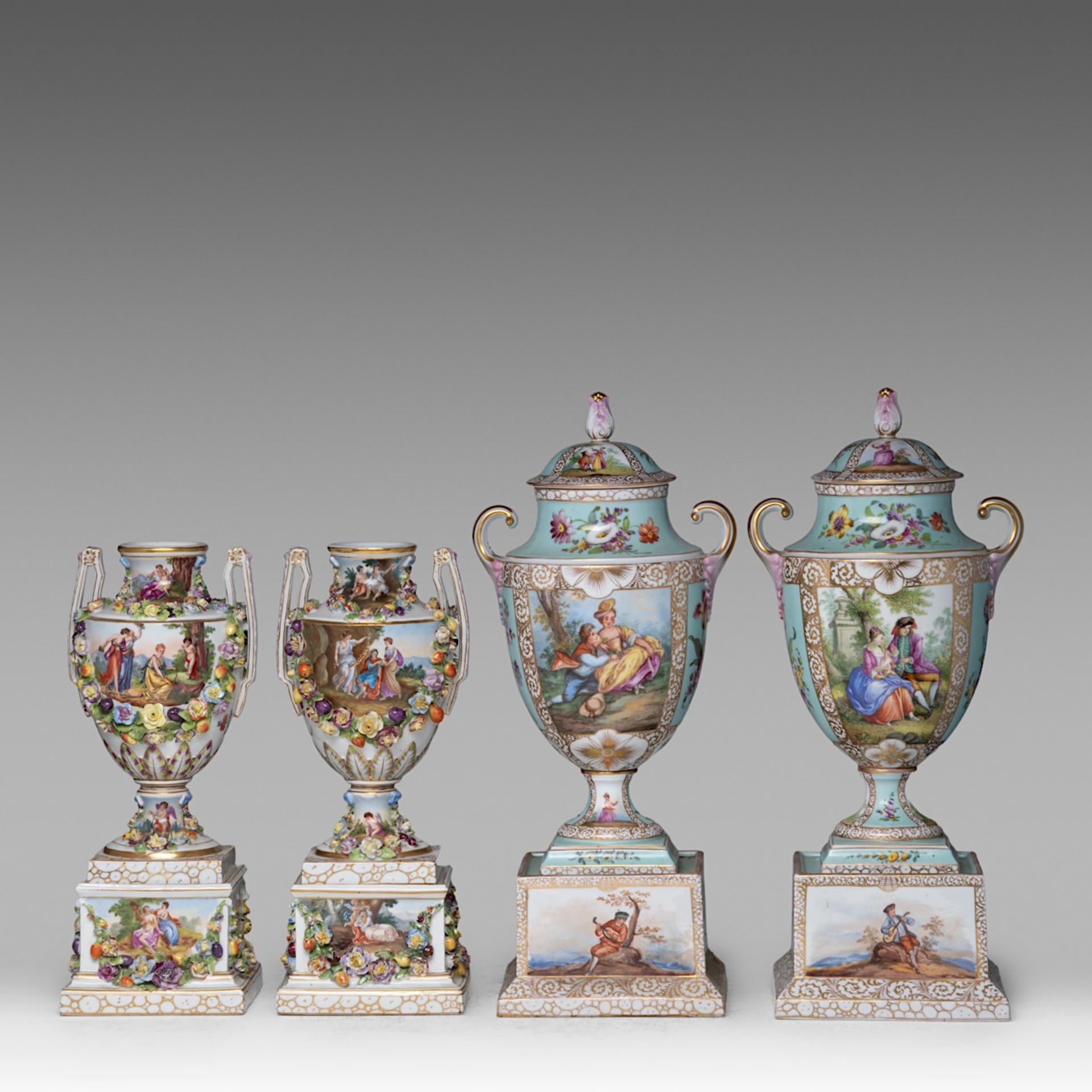 A large near pair of Vienna (or Dresden) hand-painted porcelain vases, and a smaller matching pair o