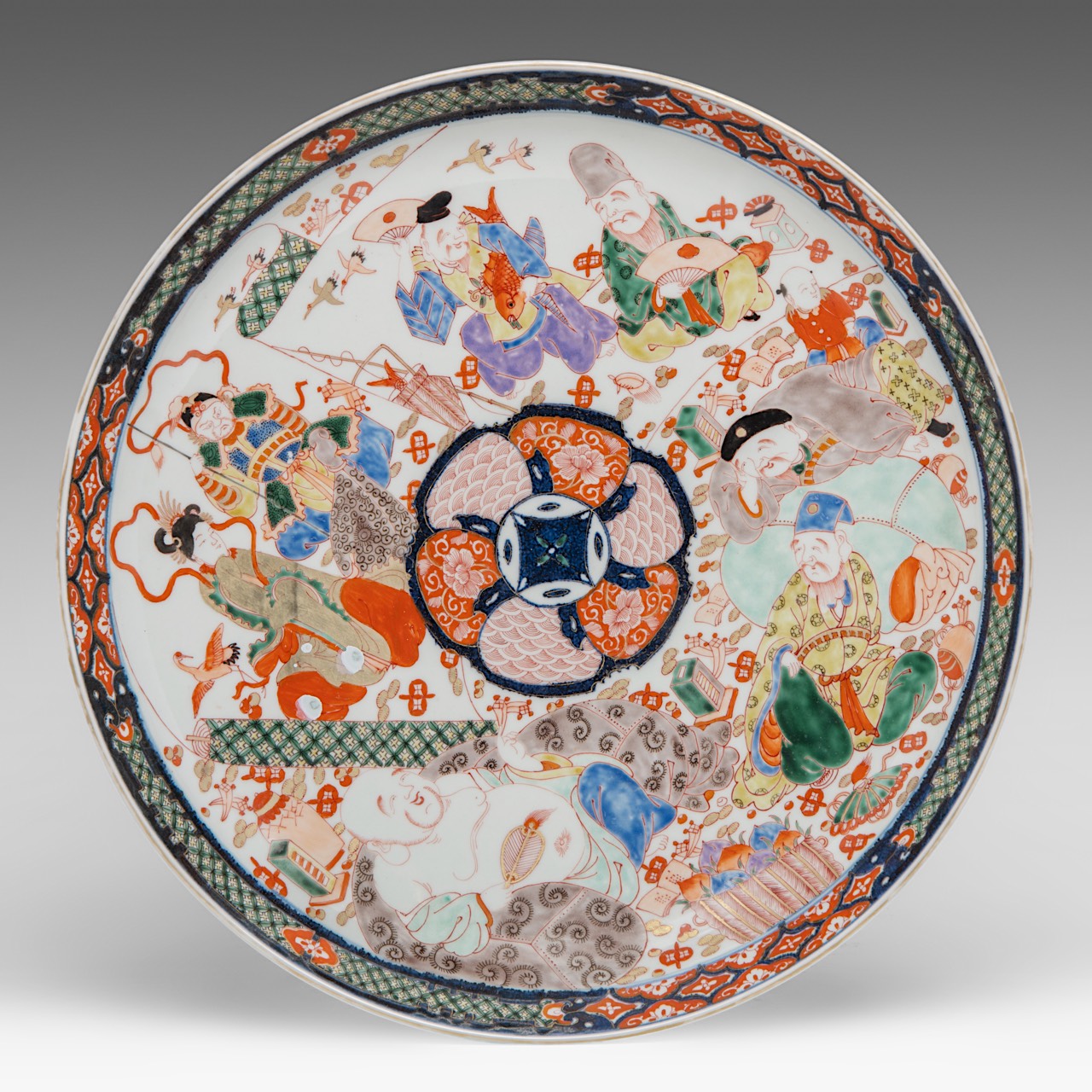 A large Japanese Imari 'Immortals' plate, late Meiji (1868-1912), dia 43 cm