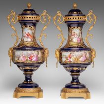 A pair of blue royale ground Sevres vases with hand-painted gallant scenes and gilt bronze mounts, H
