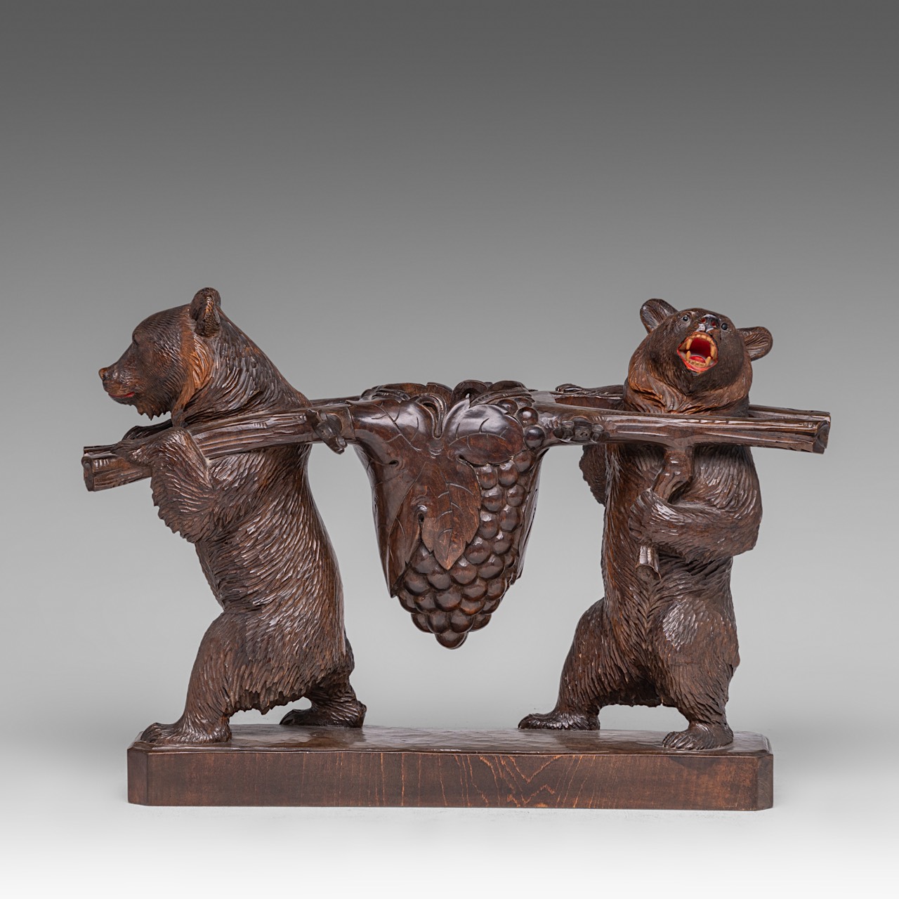 A Black Forest carved wooden liquor stand with two bears carrying the decanter and six glasses, H 4 - Image 5 of 10