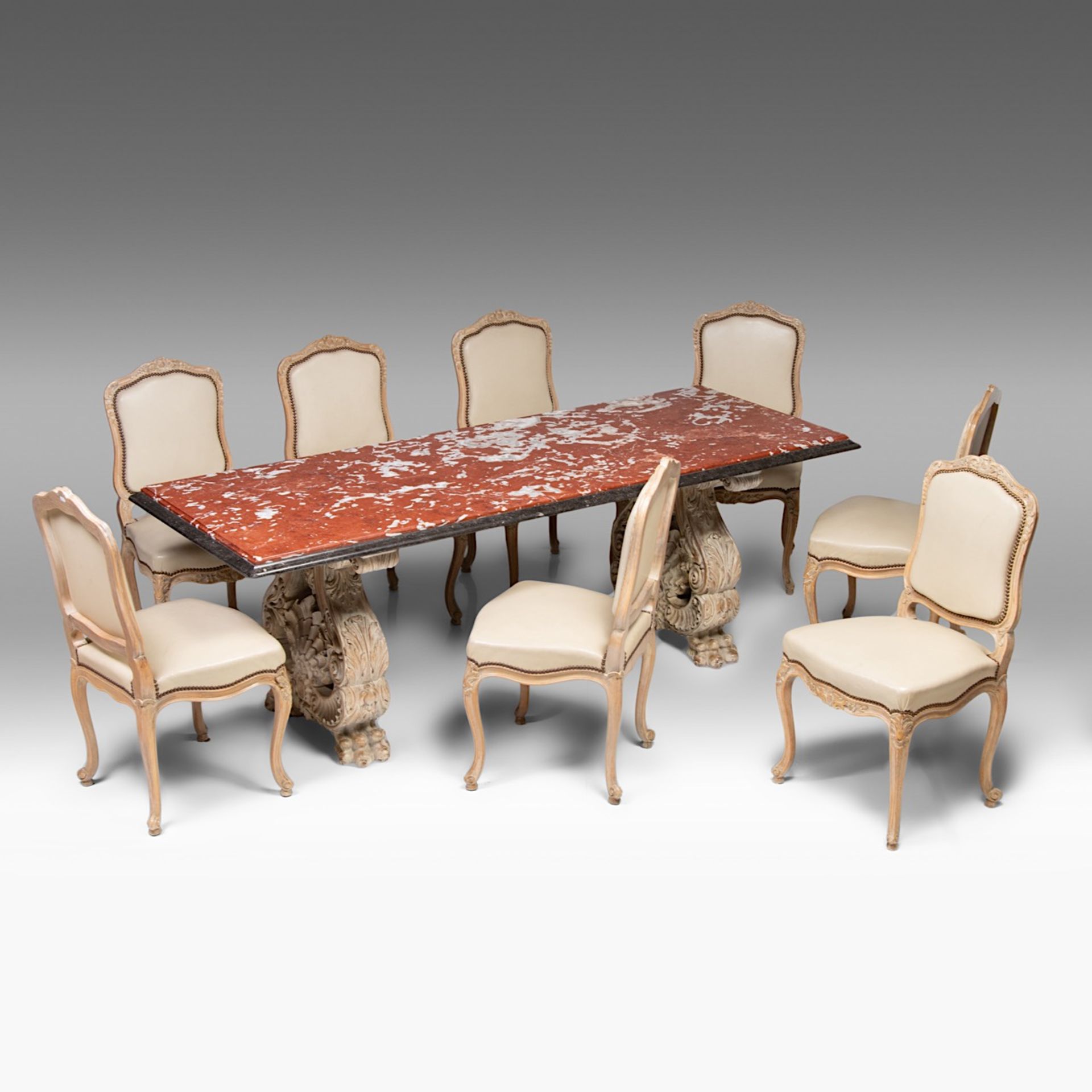 A Renaissance-style marble-topped table with sculpted wood trestles, H 76 cm - W 219 cm - D 84 cm