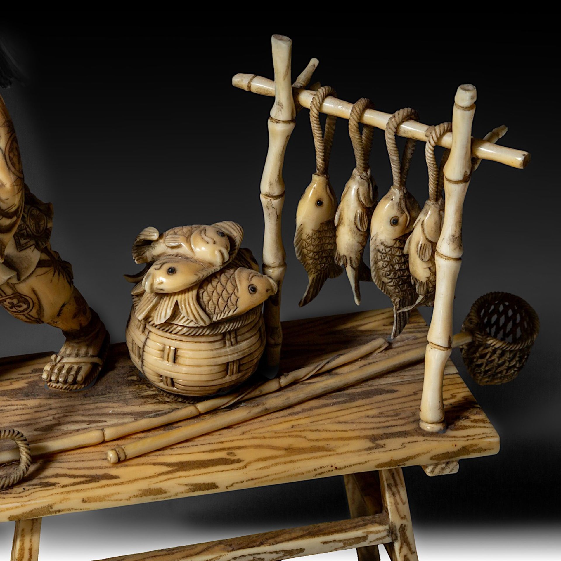A Japanese walrus ivory okimono of a man and his son fishing on a dock, Meiji (1868-1912)/Taisho per - Image 9 of 11