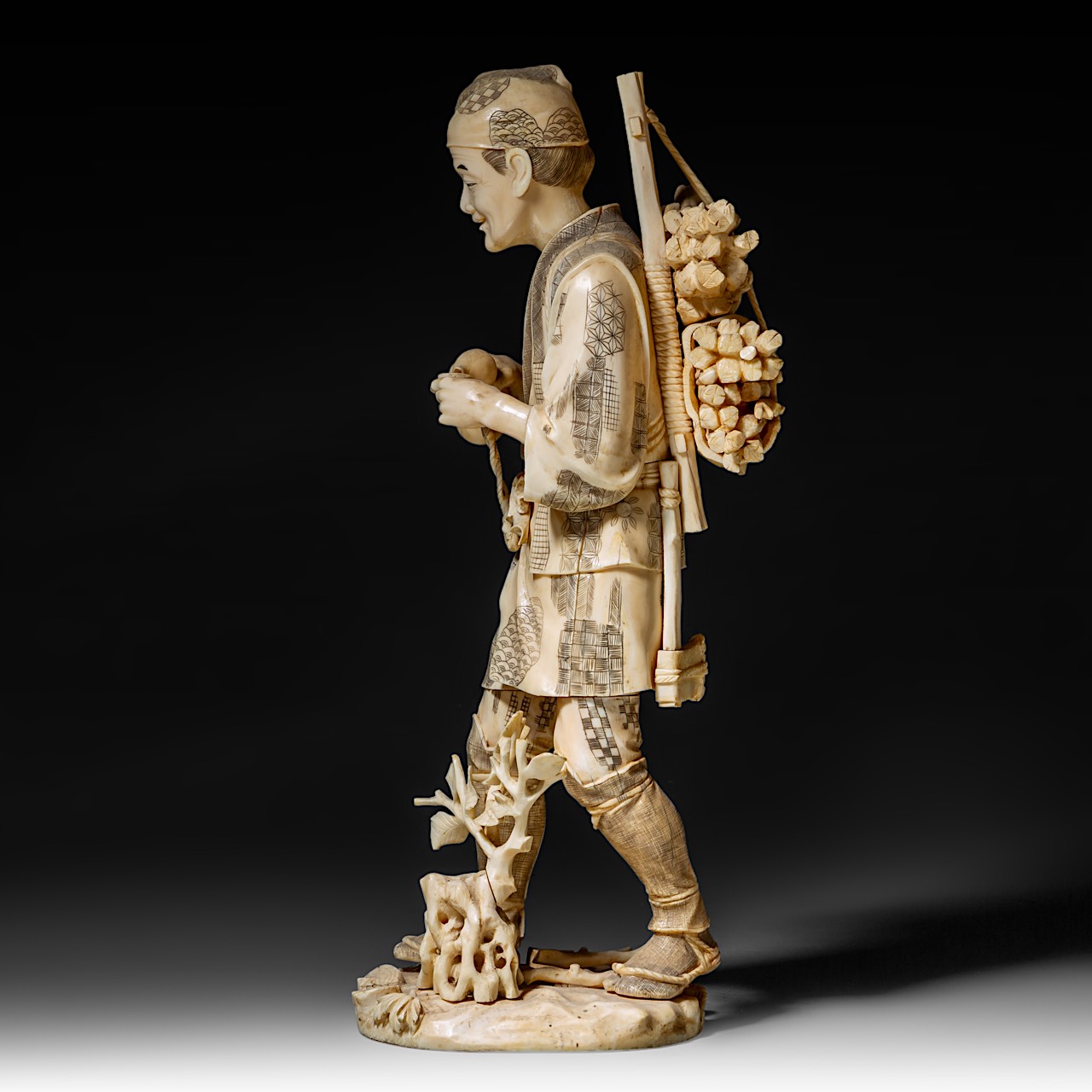 A large Japanese walrus ivory okimono of a wood gatherer drinking from a gourd flask, Meiji period ( - Image 3 of 10