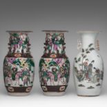 A pair of Chinese famille rose Nanking stoneware vases, 19thC, H 43,5 cm - and a famille rose 'Beaut