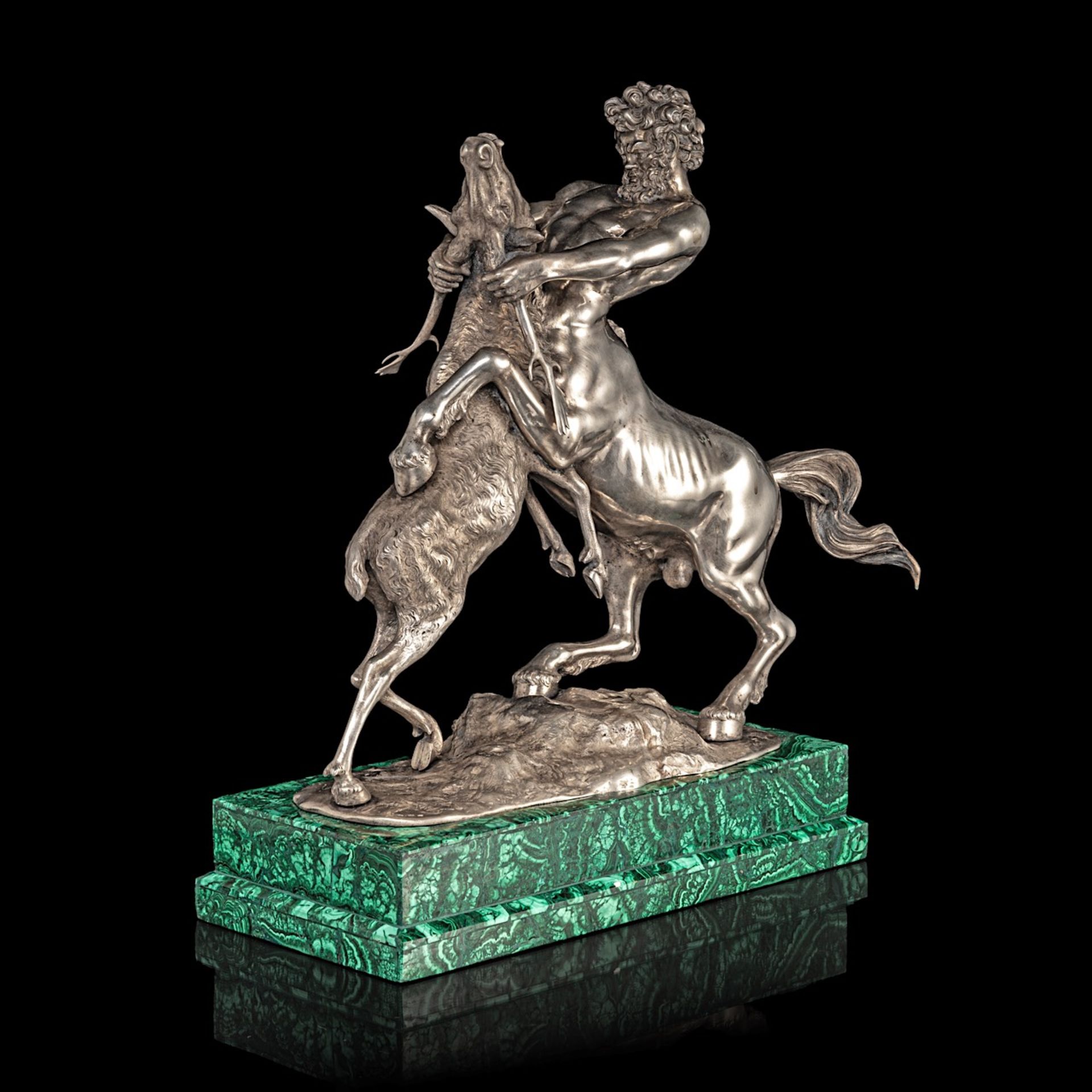A silver figure of a centaur and deer fighting on a malachite veneered base, 800/000 35.5 x 36 x 13