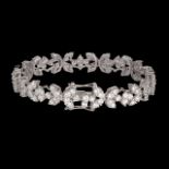 An 18ct white gold and floral set diamond riviere bracelet, total weight: 22,39 g