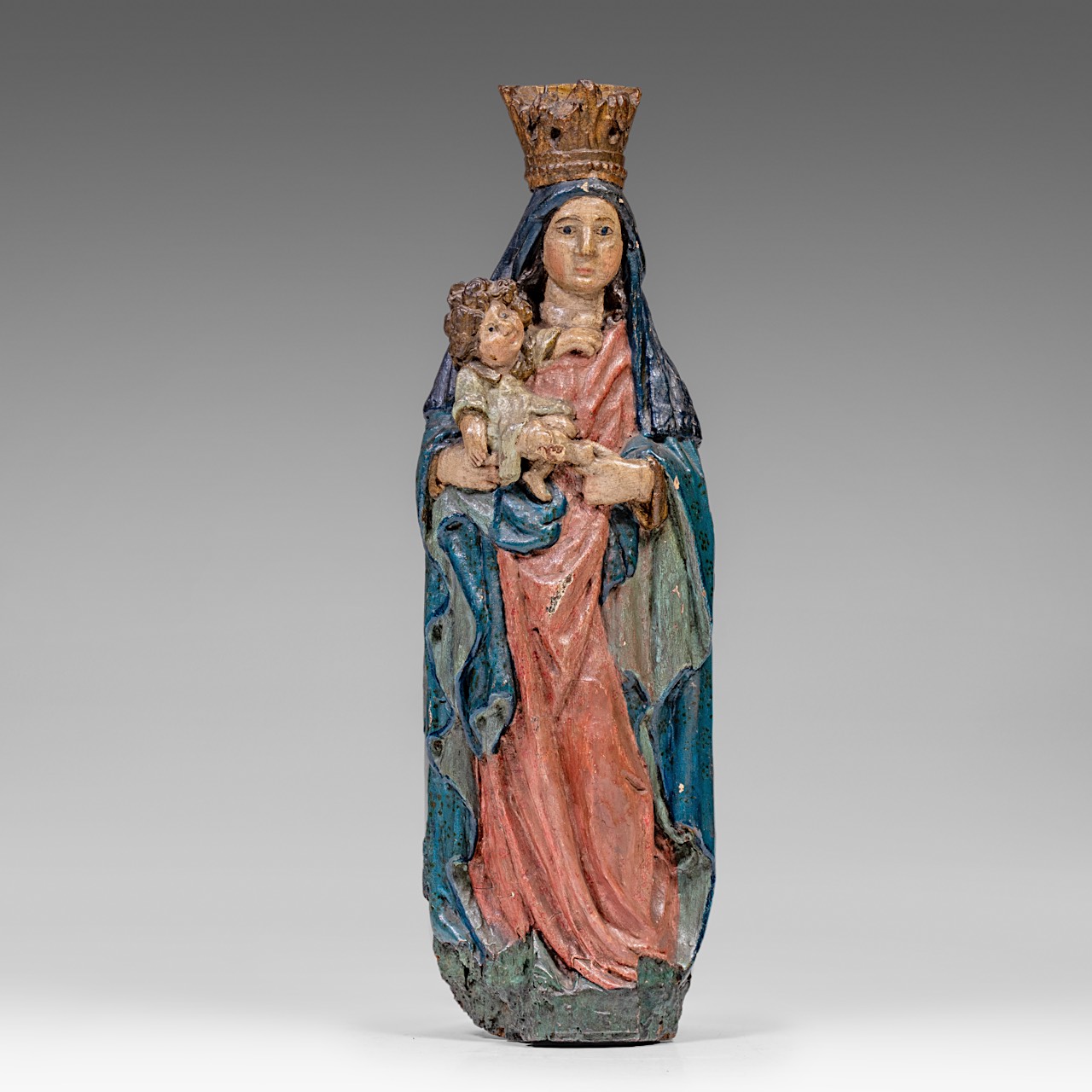 A polychrome wooden Madonna holding the Holy Child, 16thC, H 87 cm
