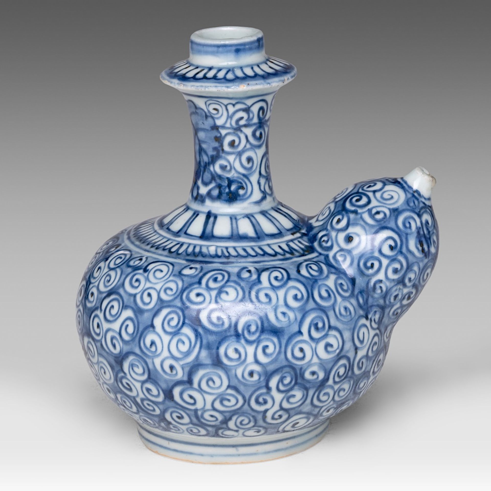 A Chinese blue and white Kendi jug decorated with scrolling tendrils, marked with a rabbit, 17thC, H - Image 5 of 7