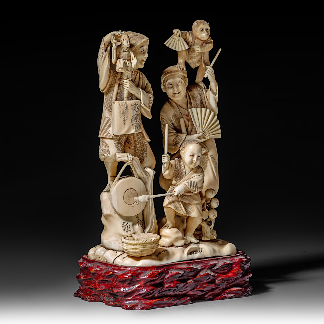 A large Japanese walrus ivory okimono of a musical family, Meiji period (1868-1912), H 26 cm - 1906g - Image 7 of 12