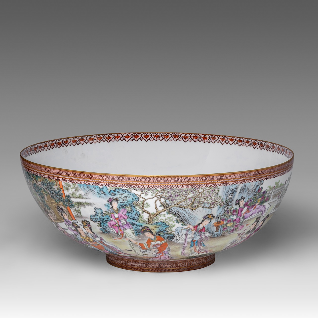 A rare and large Chinese famille rose 'Beauties in a Garden' eggshell punch bowl, with a Yongzheng m